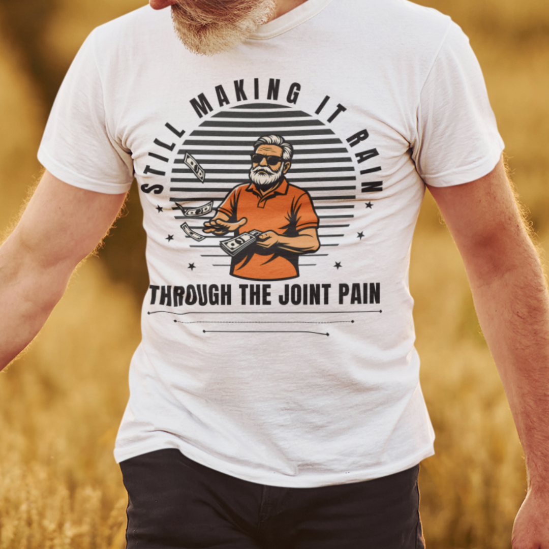 White t-shirt with a gray-bearded man in an orange golf shirt raining dollar bills