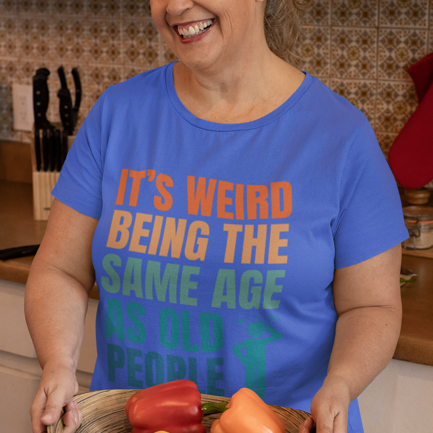 Royal blue tee featuring bold, multi-color lettering and with a pictogram of a person scratching their head in confusion