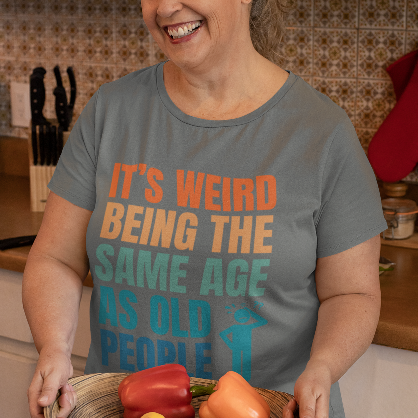Gray tee featuring bold, multi-color lettering and with a pictogram of a person scratching their head in confusion