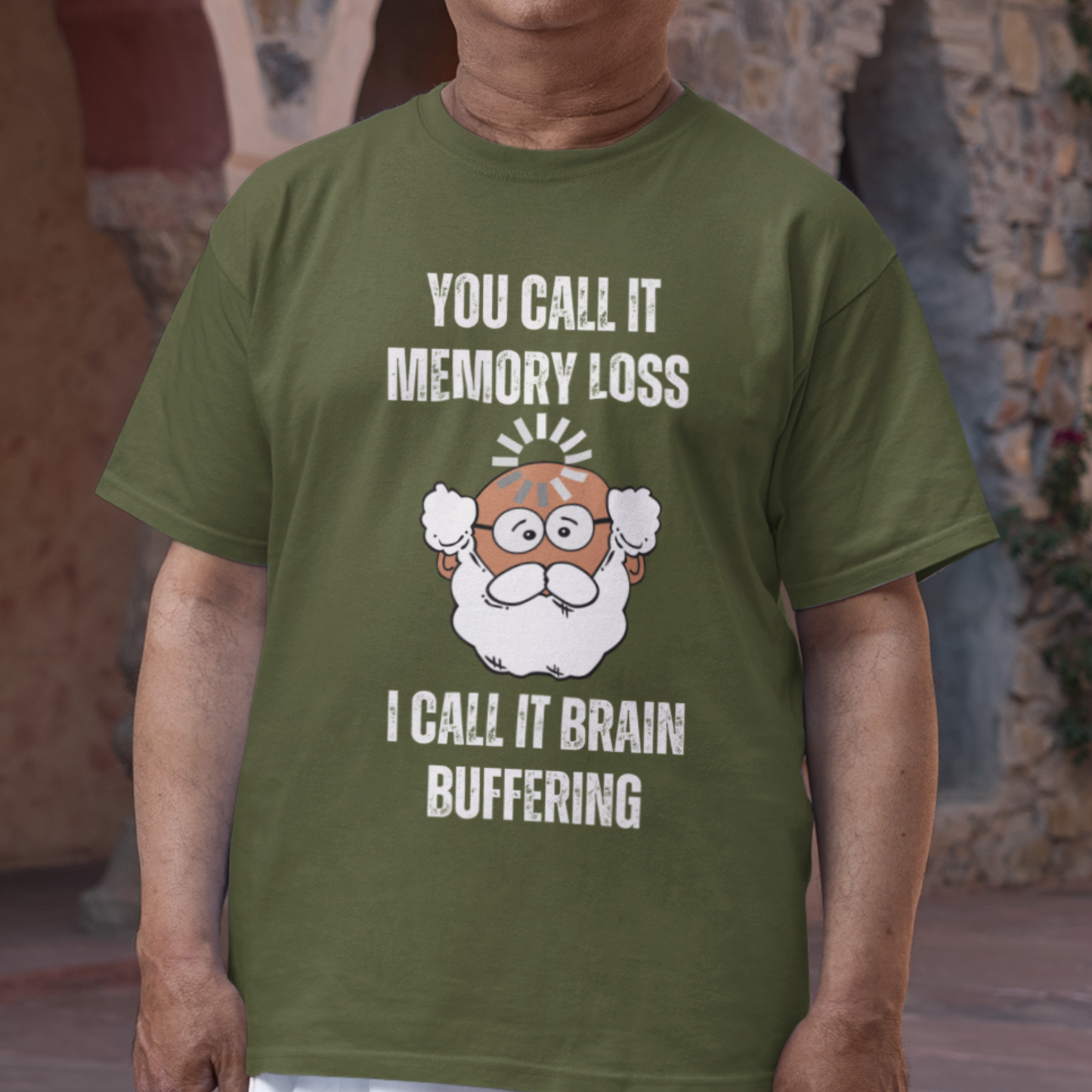 Military green t-shirt featuring the phrase 'Brain Buffering' with a loading icon graphic and a bald, bearded medium-toned senior.