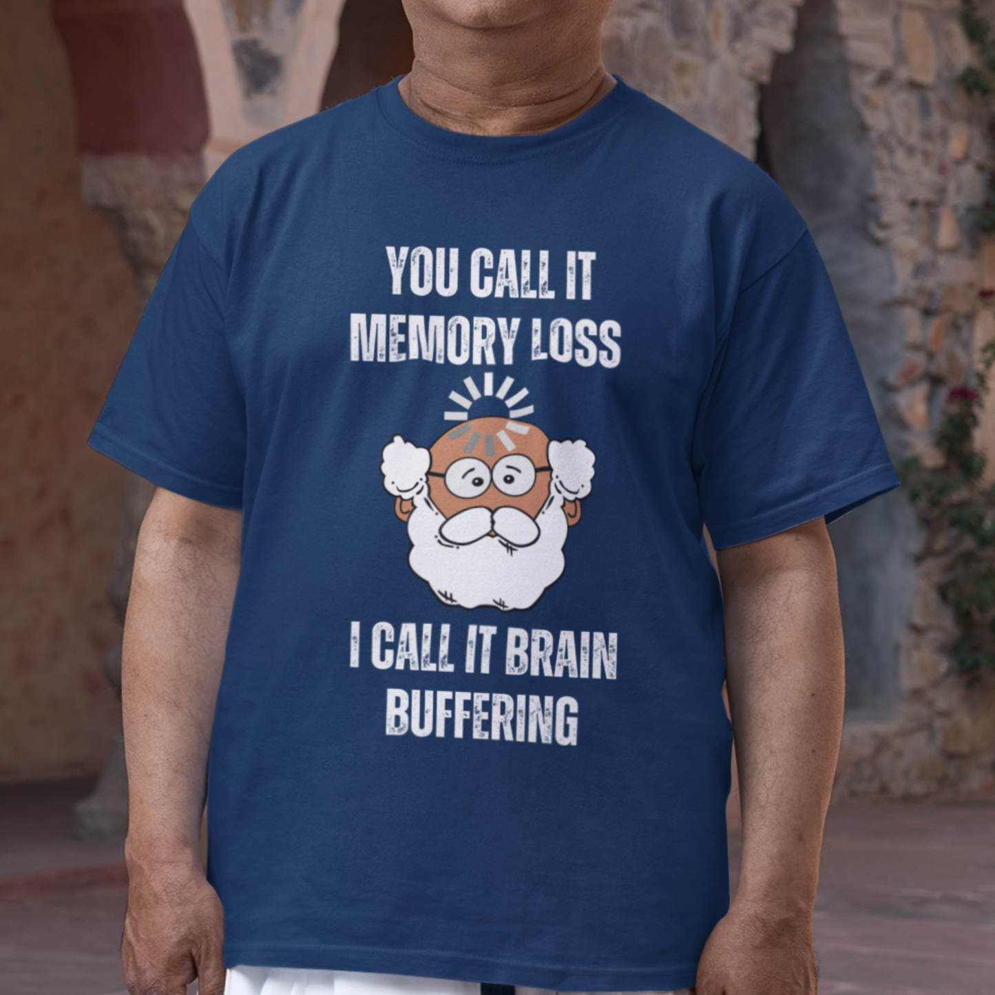Navy blue t-shirt featuring the phrase 'Brain Buffering' with a loading icon graphic and a bald, bearded medium-toned senior.