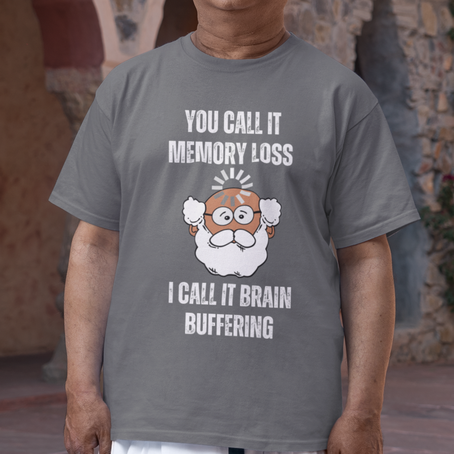 Heather gray t-shirt featuring the phrase 'Brain Buffering' with a loading icon graphic and a bald, bearded medium-toned senior.