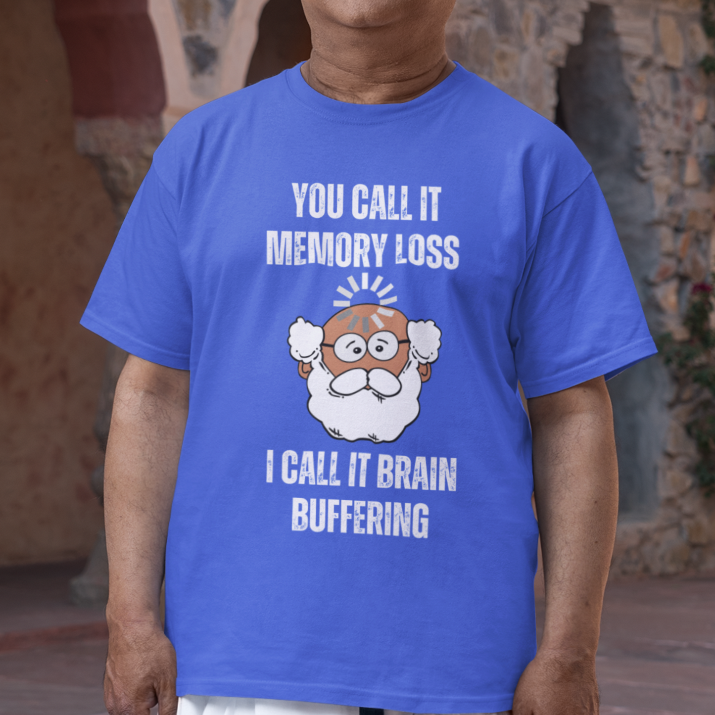 Royal blue t-shirt featuring the phrase 'Brain Buffering' with a loading icon graphic and a bald, bearded medium-toned senior.