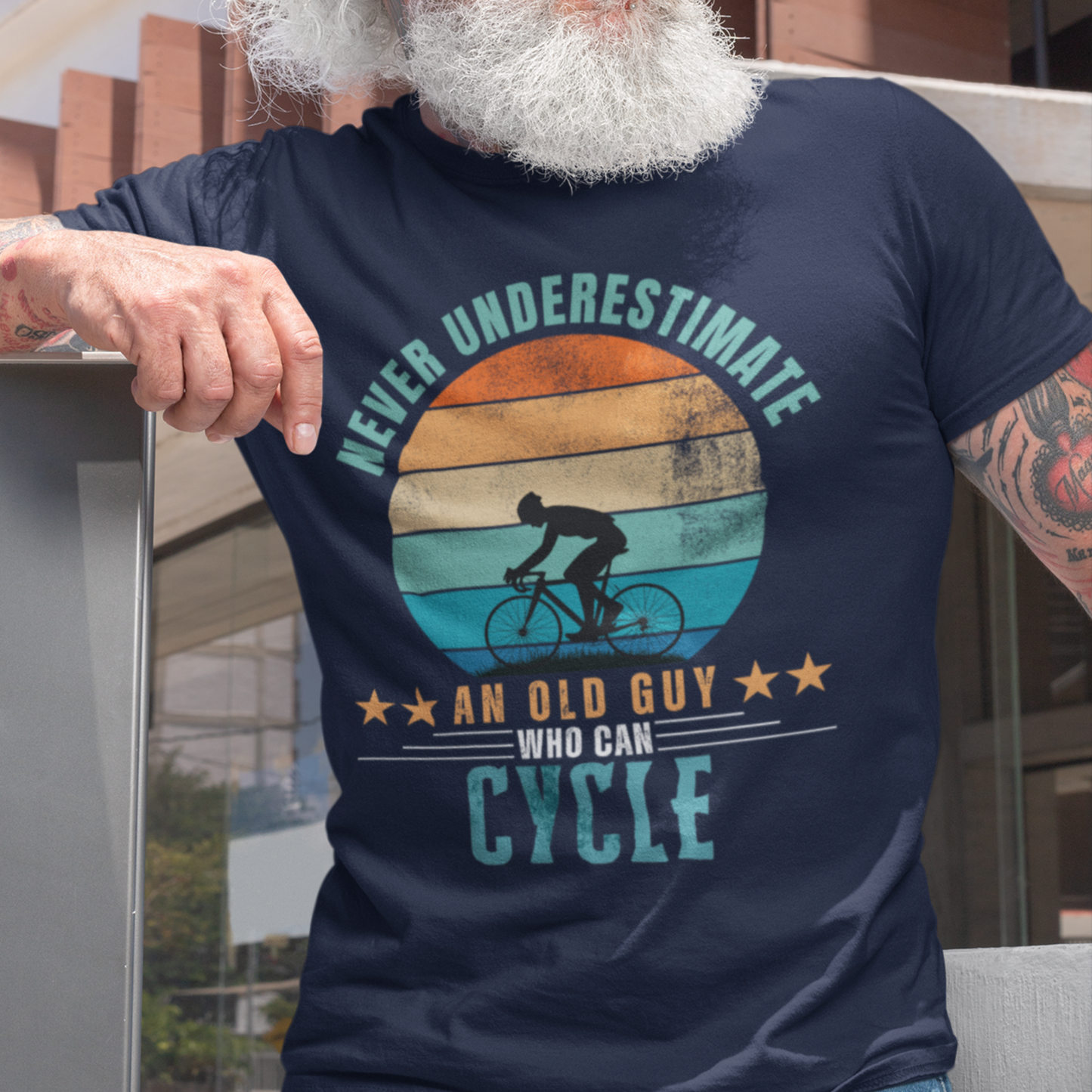 Navy blue tee featuring silhouette of a guy on a bicycle against a distressed striped sunset