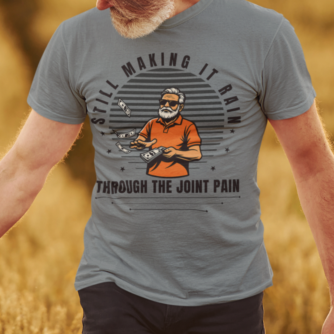 Heather gray t-shirt with a gray-bearded man in an orange golf shirt raining dollar bills
