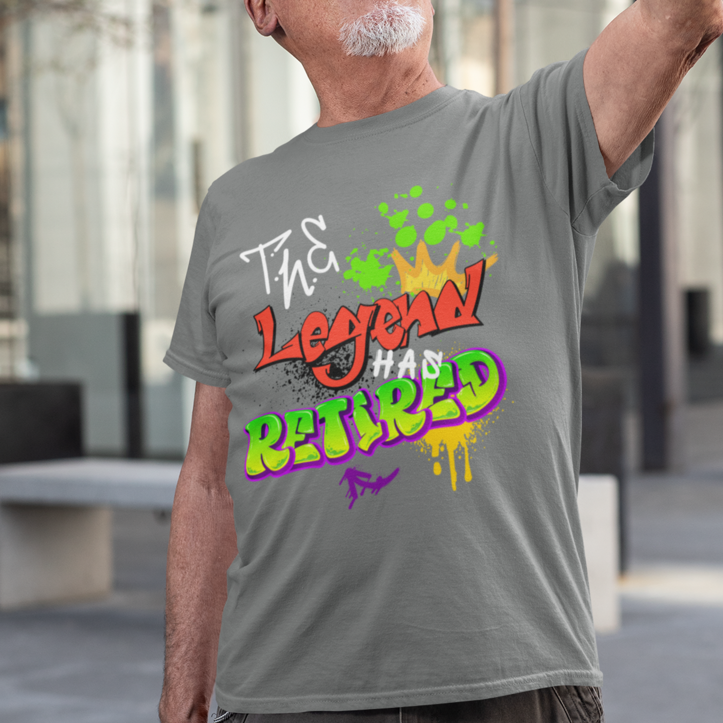 Heather gray t-shirt featuring bold graffiti style fonts states "The Legend Has Retired"