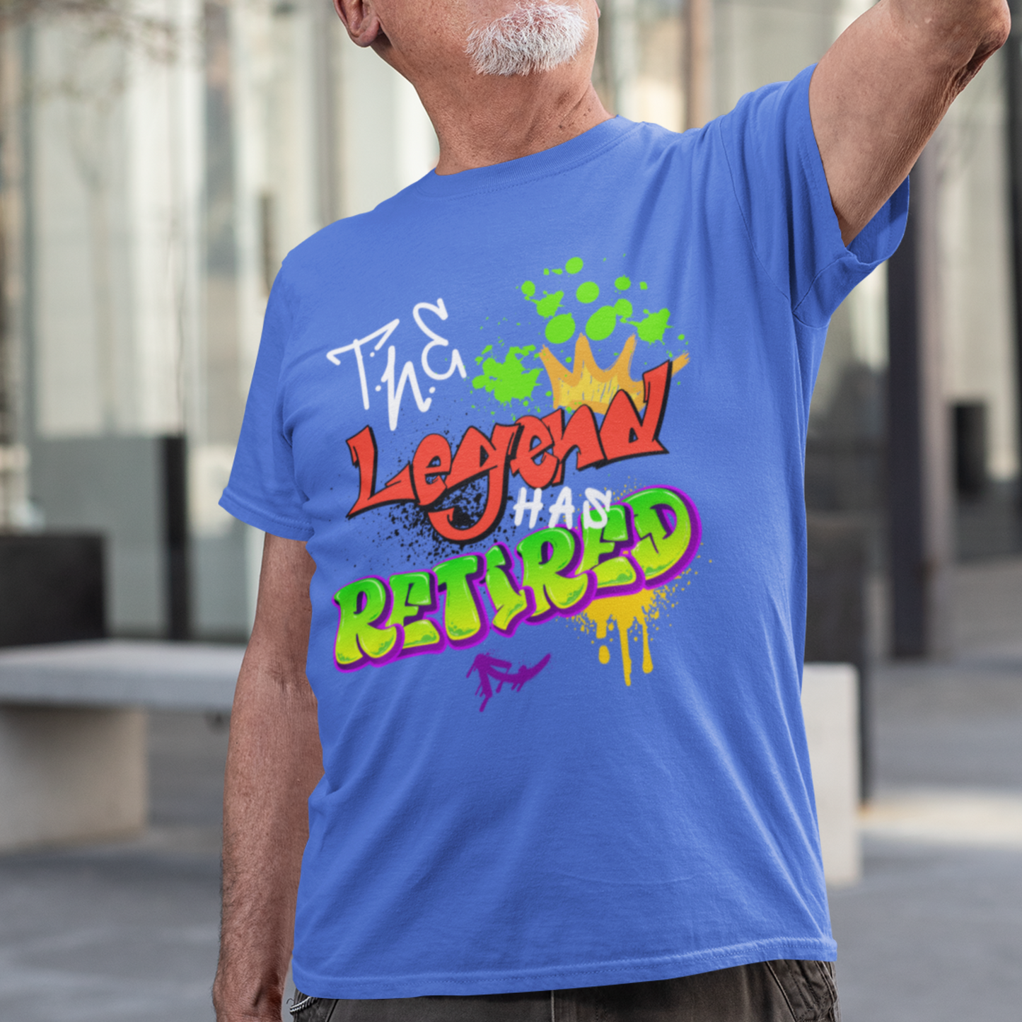 Royal blue t-shirt featuring bold graffiti style fonts states "The Legend Has Retired"