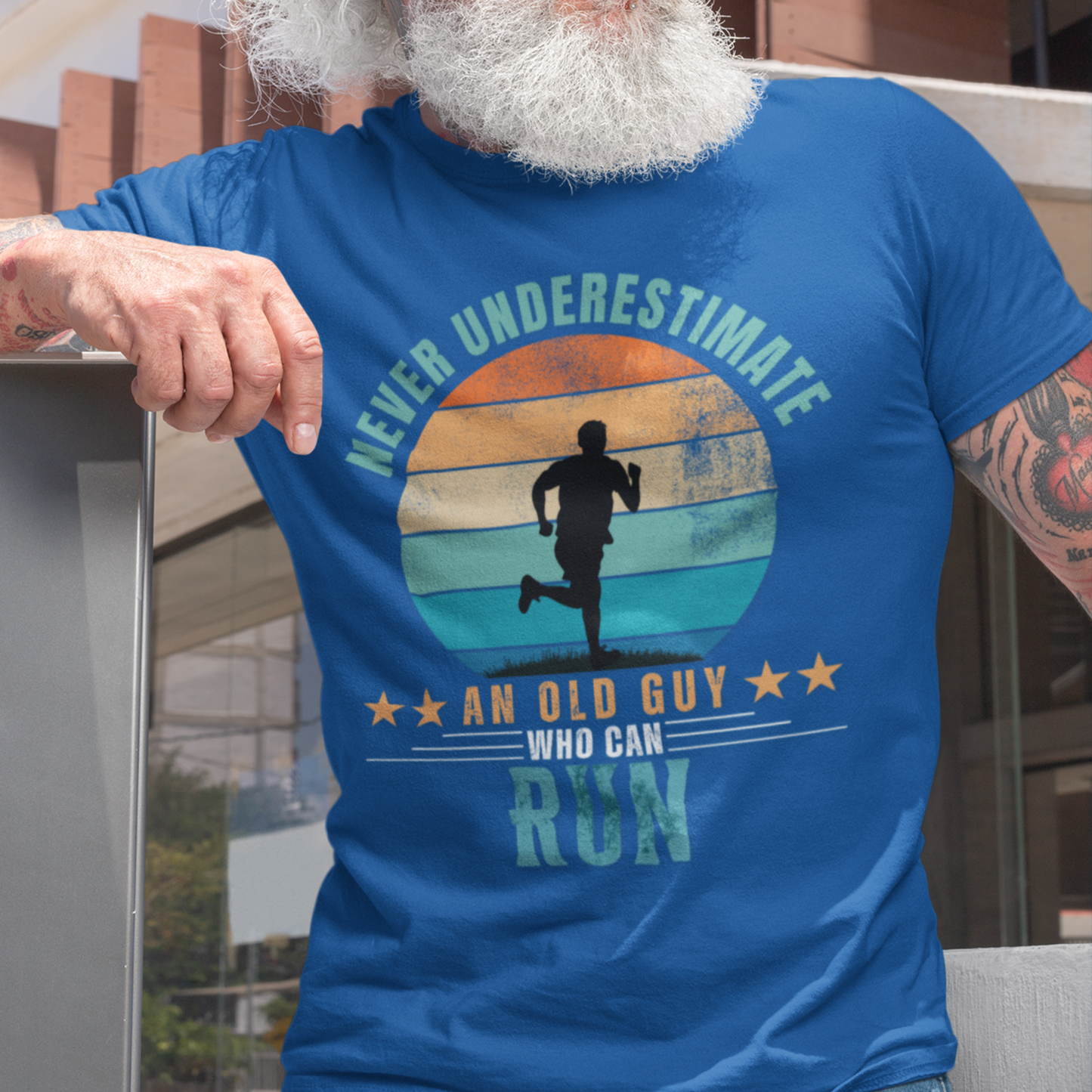 Royal blue tee featuring silhouette of a jogger against a distressed striped sunset