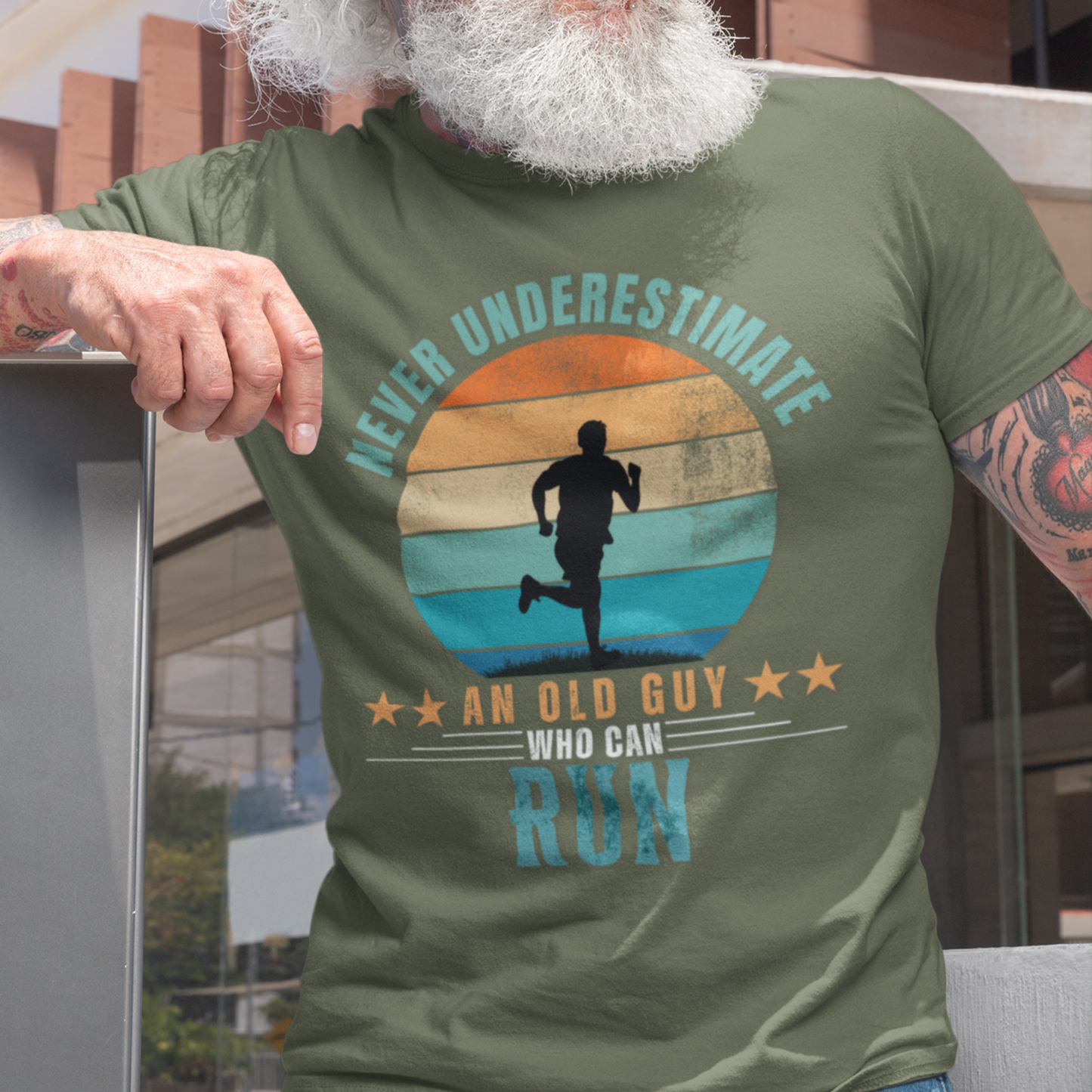 Military green tee featuring silhouette of a jogger against a distressed striped sunset