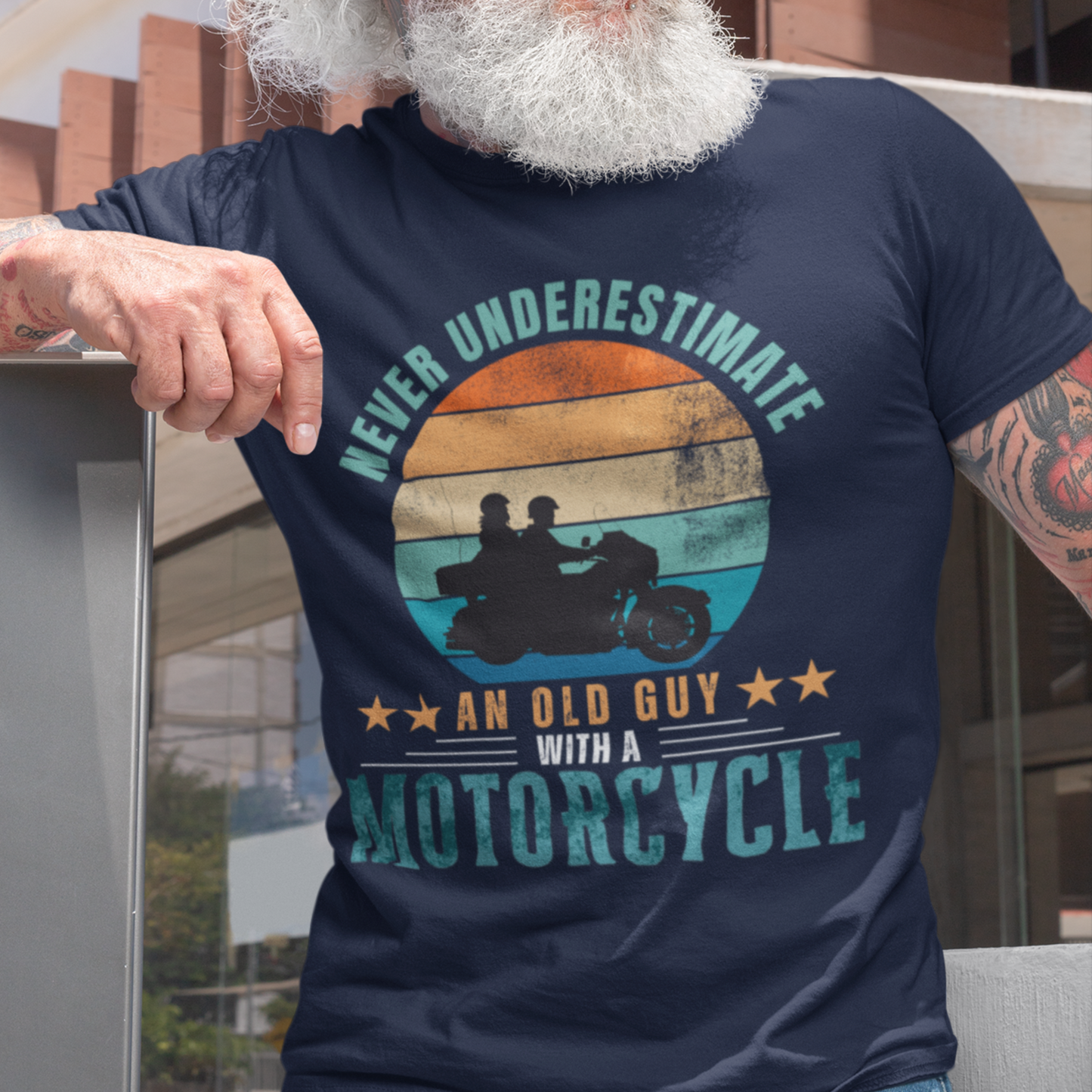 Navy blue tee featuring silhouette of a guy on a cruiser with his lady against a distressed striped sunset