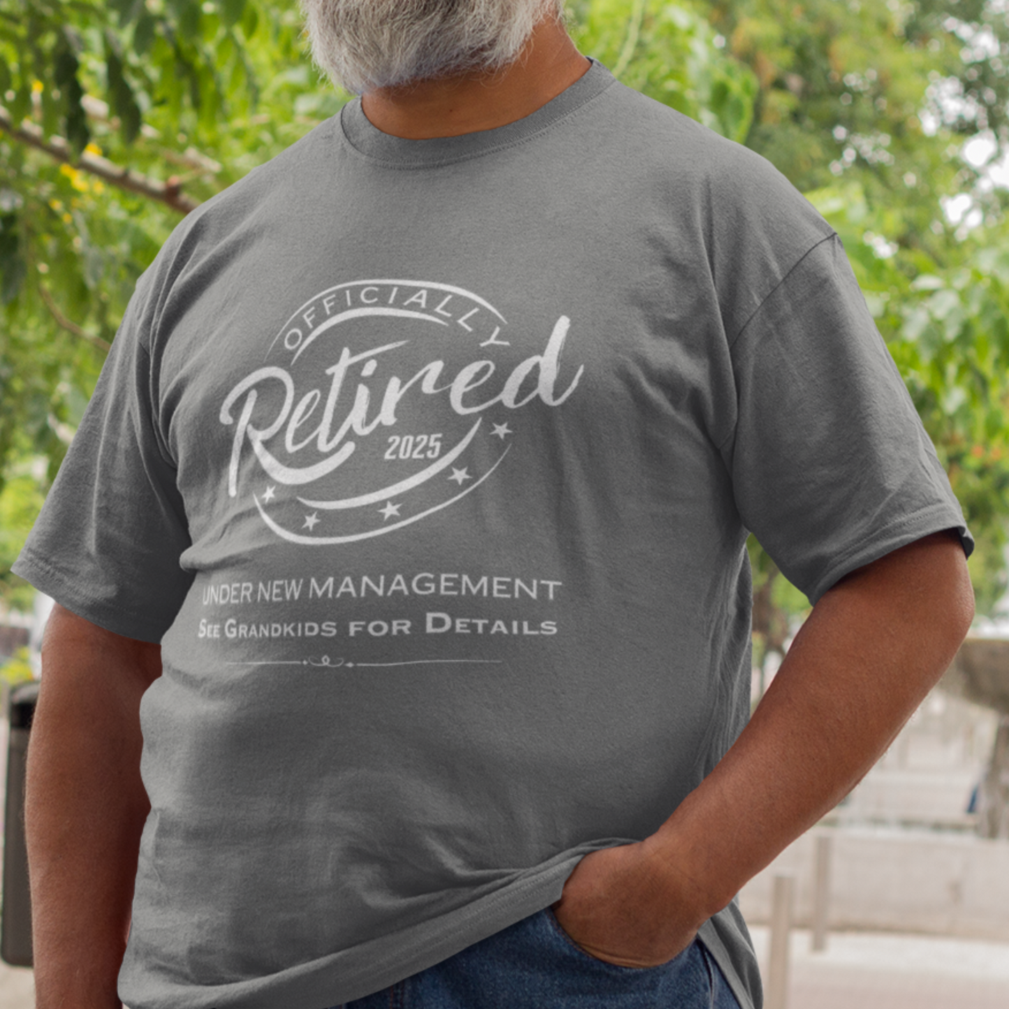 Heather gray tee featuring a replica of an official stamp embossing that reads "Officially Retired 2025 See Grandkids".