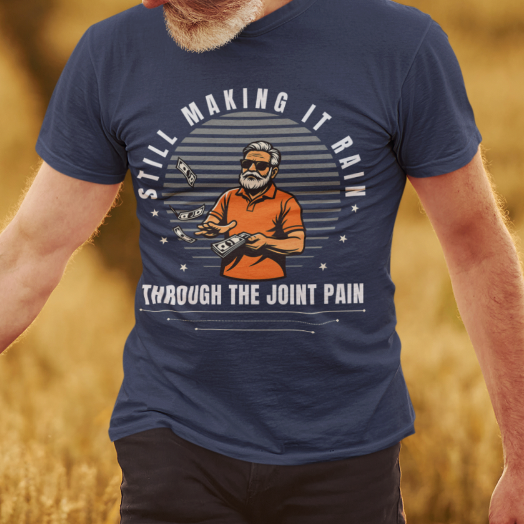Navy blue t-shirt with a gray-bearded man in an orange golf shirt raining dollar bills