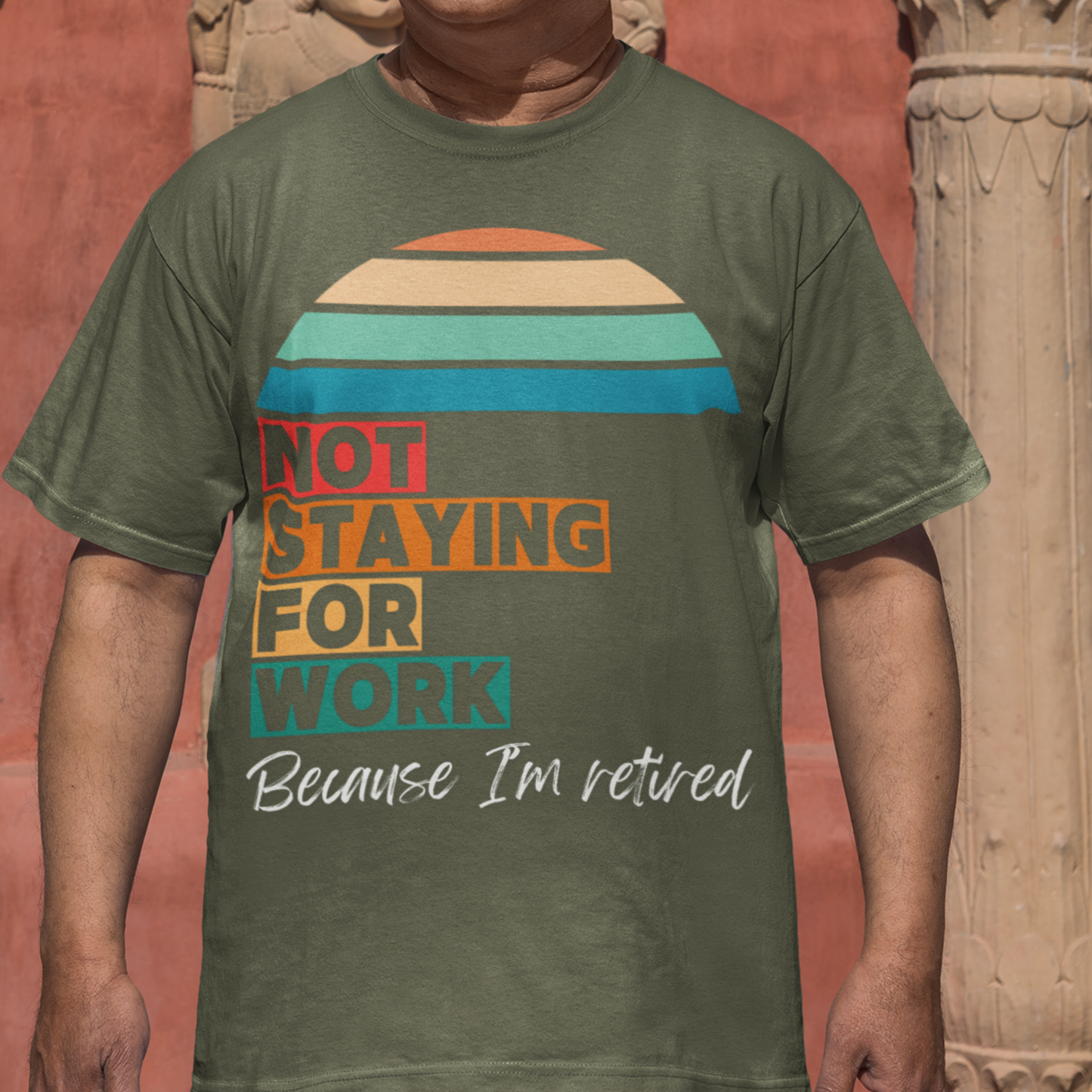 Military green tee in multi-color block lettering and rainbow sun reads Not Staying for Work I'm Retired