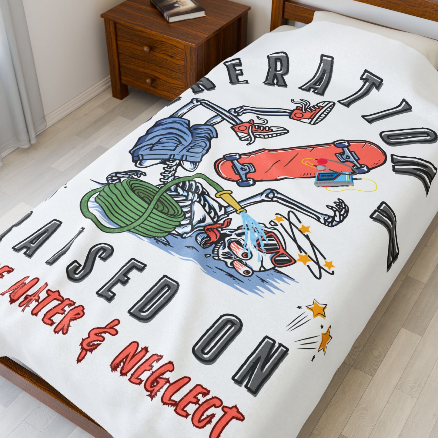 60X80 blanket with colorful graphics and text on a bed in a room.