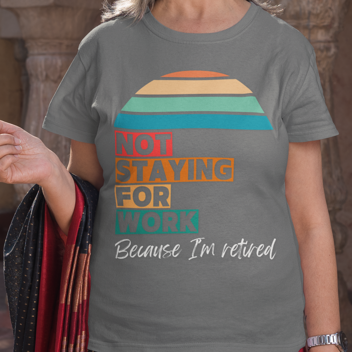 Gray tee in multi-color block lettering and rainbow sun reads Not Staying for Work I'm Retired