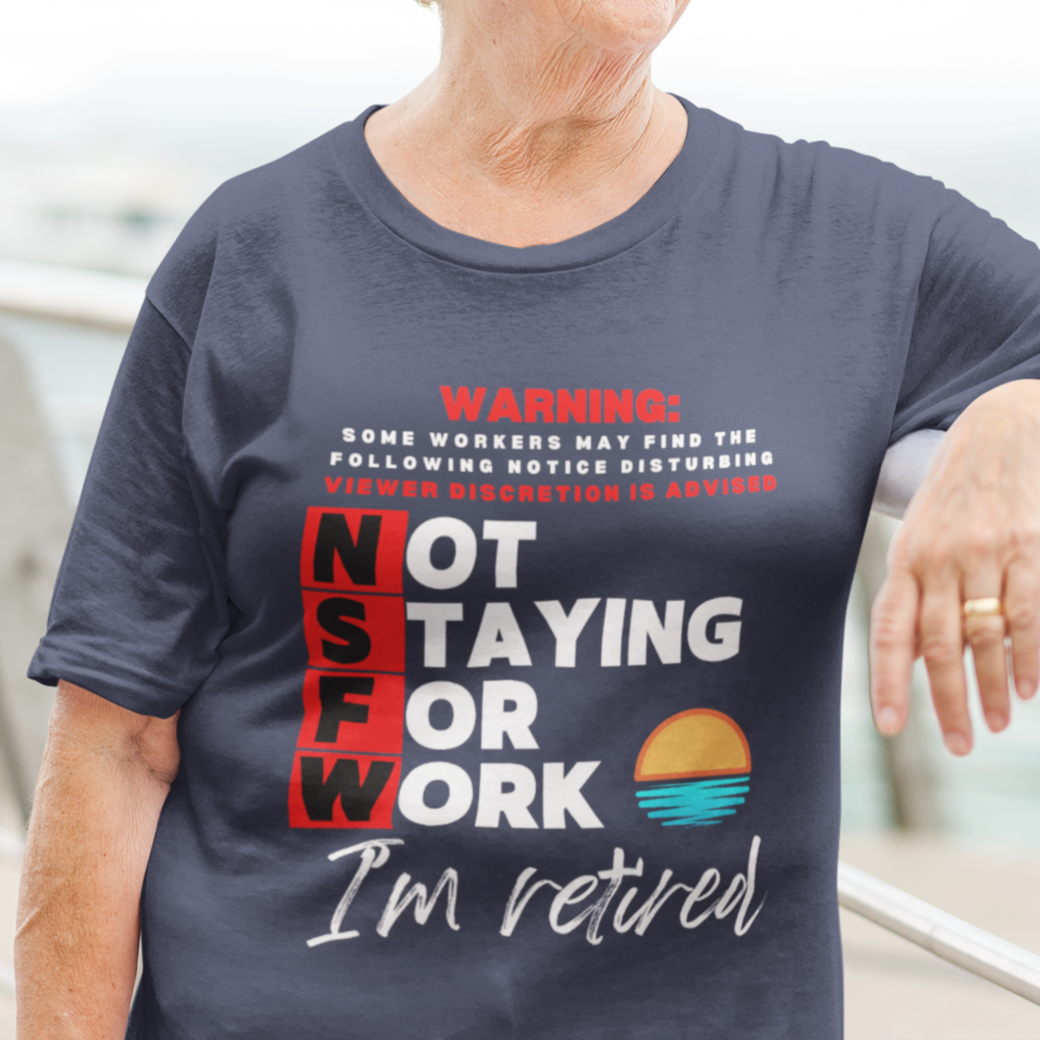 Navy blue tee with movie-style design of the NSFW warning and a sunset motif announcing retirement