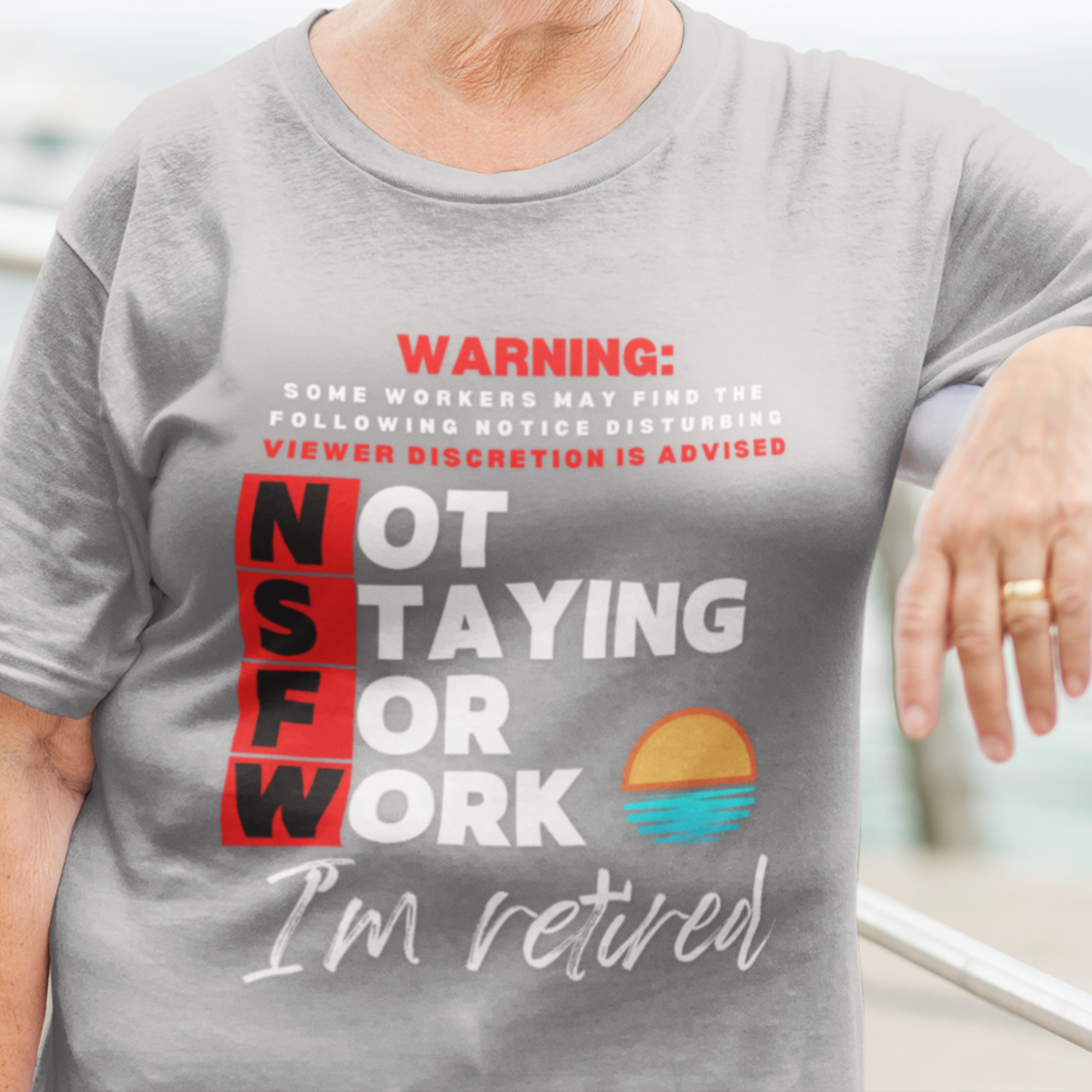 Heather gray tee with movie-style design of the NSFW warning and a sunset motif announcing retirement