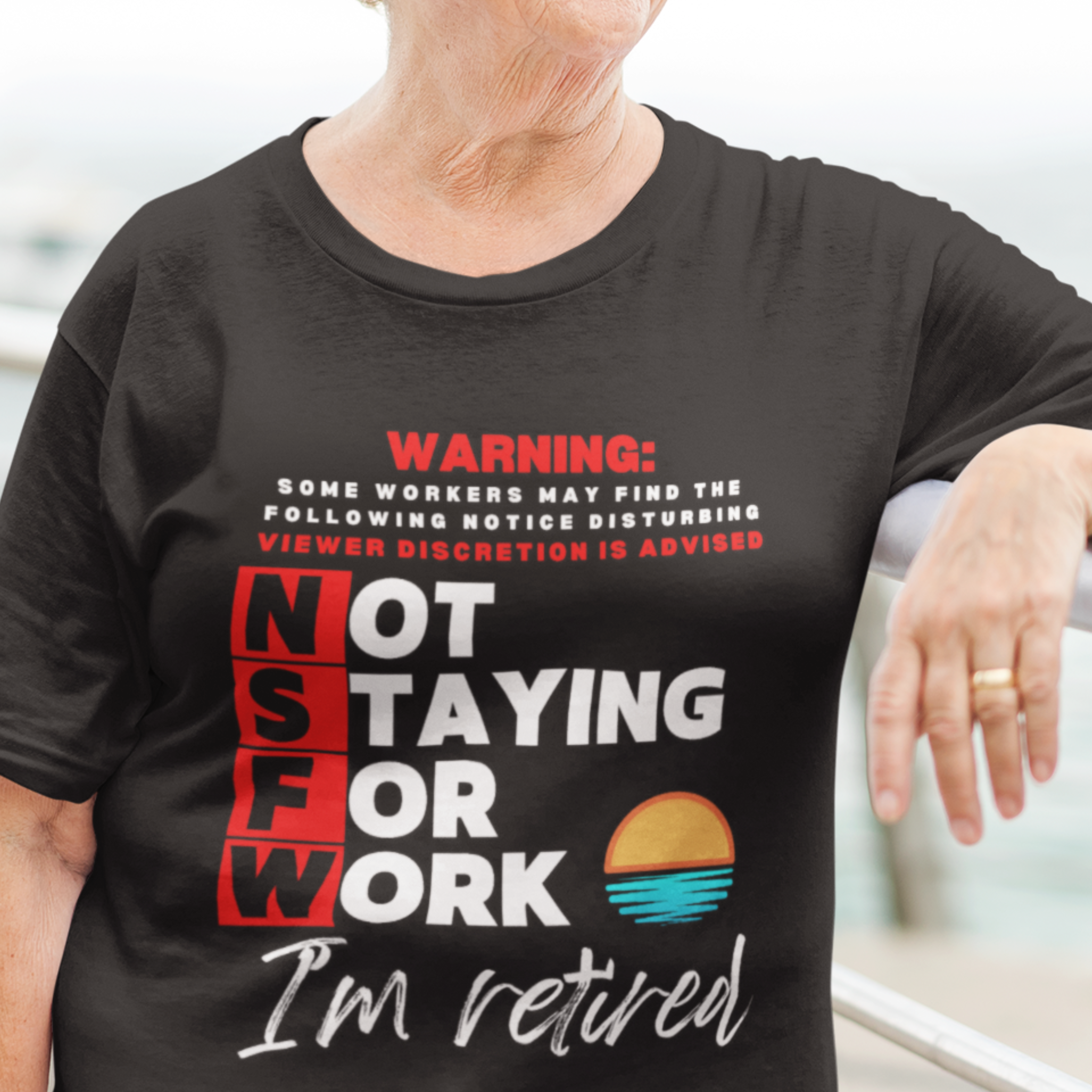 Black tee with movie-style design of the NSFW warning and a sunset motif announcing retirement