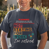 Navy blue tee featuring a NSFW warning in multi-color block lettering reads Not Staying for Work I'm Retired