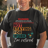 Black tee featuring a NSFW warning in multi-color block lettering reads Not Staying for Work I'm Retired
