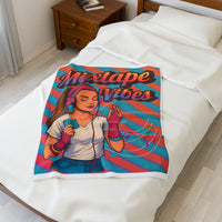 30X40 plush blanket with a design of a teen girl holding a mixtape and 'Mixtape Vibes' text, draped over a bed.