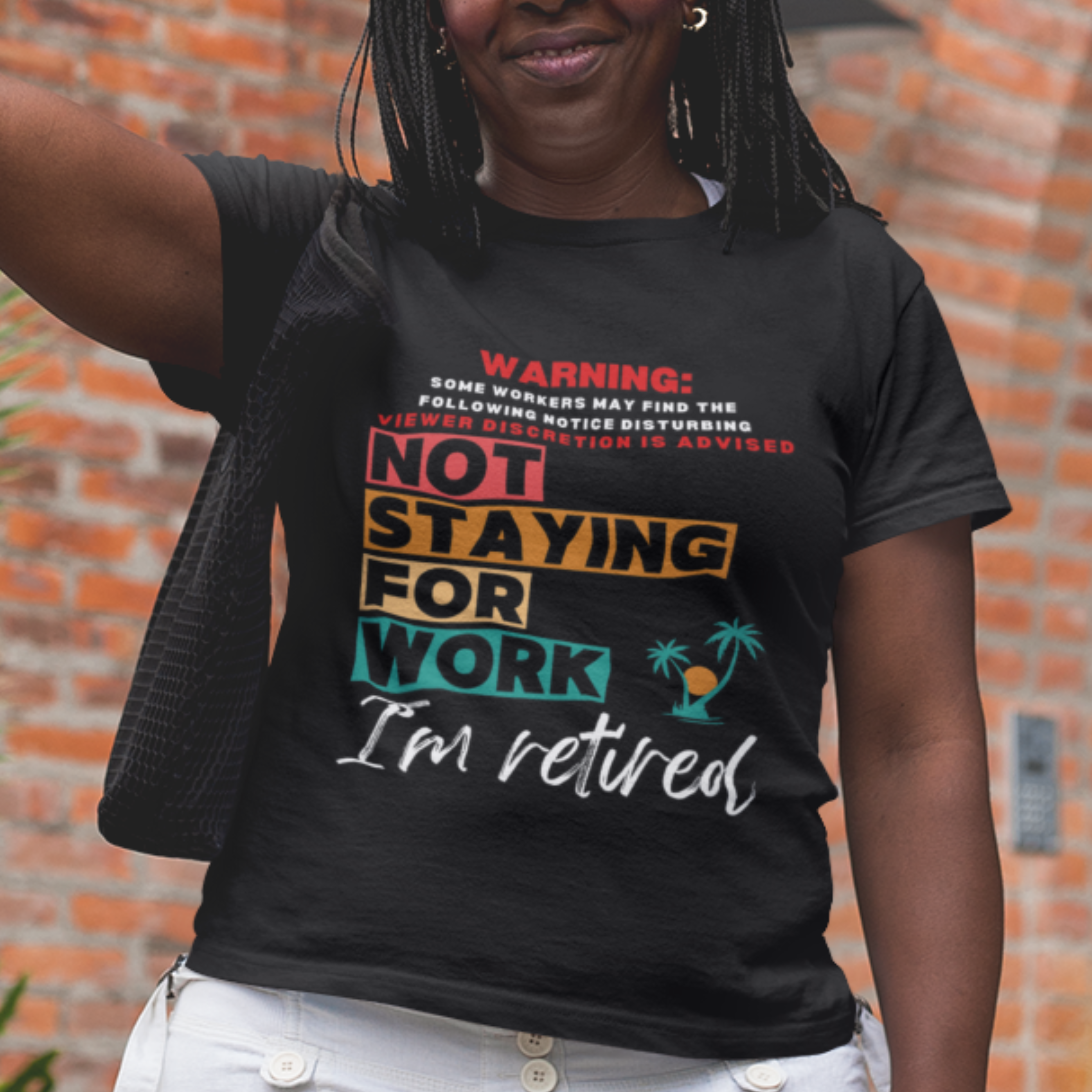 Black tee featuring a NSFW warning in multi-color block lettering reads Not Staying for Work I'm Retired