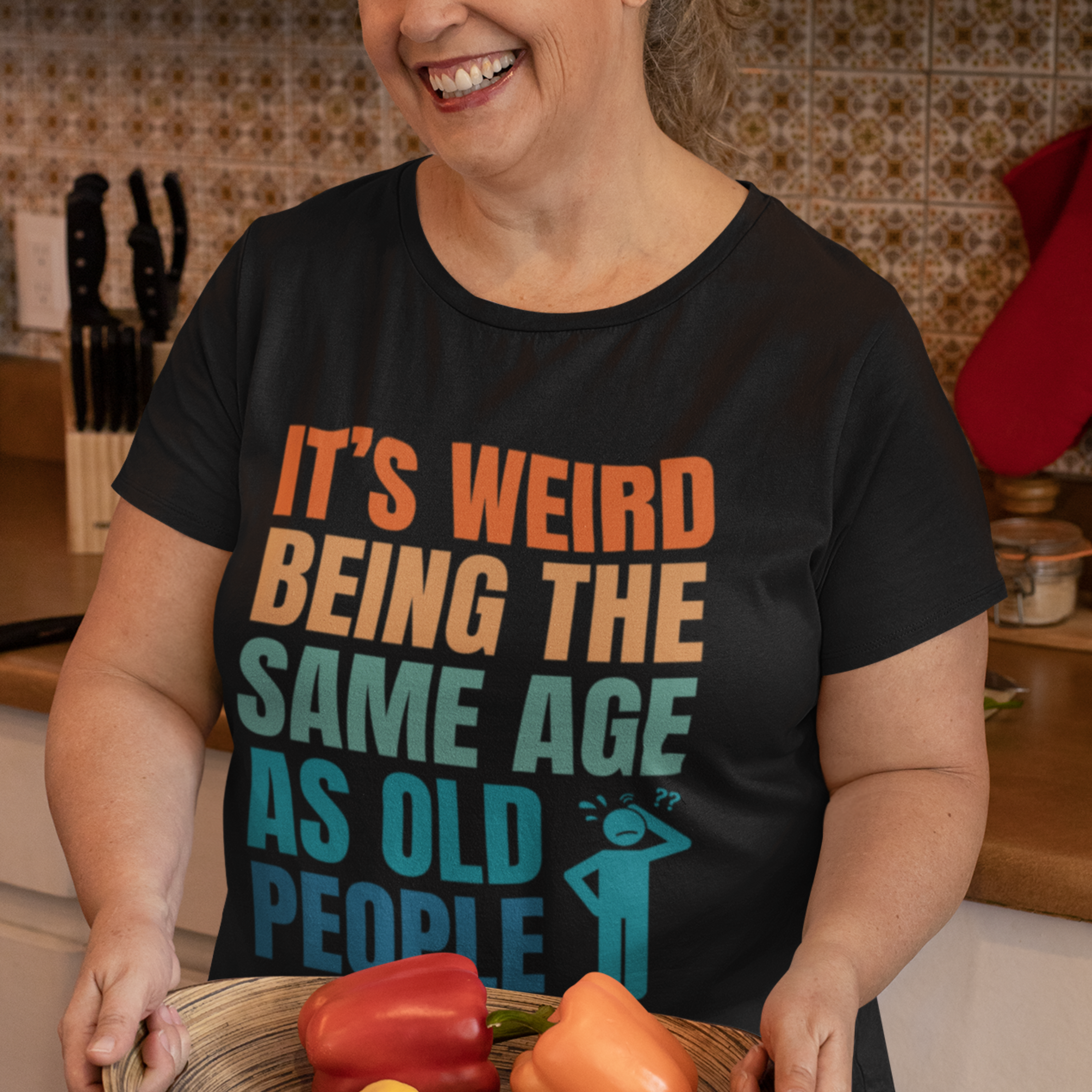 Black tee featuring bold, multi-color lettering and with a pictogram of a person scratching their head in confusion