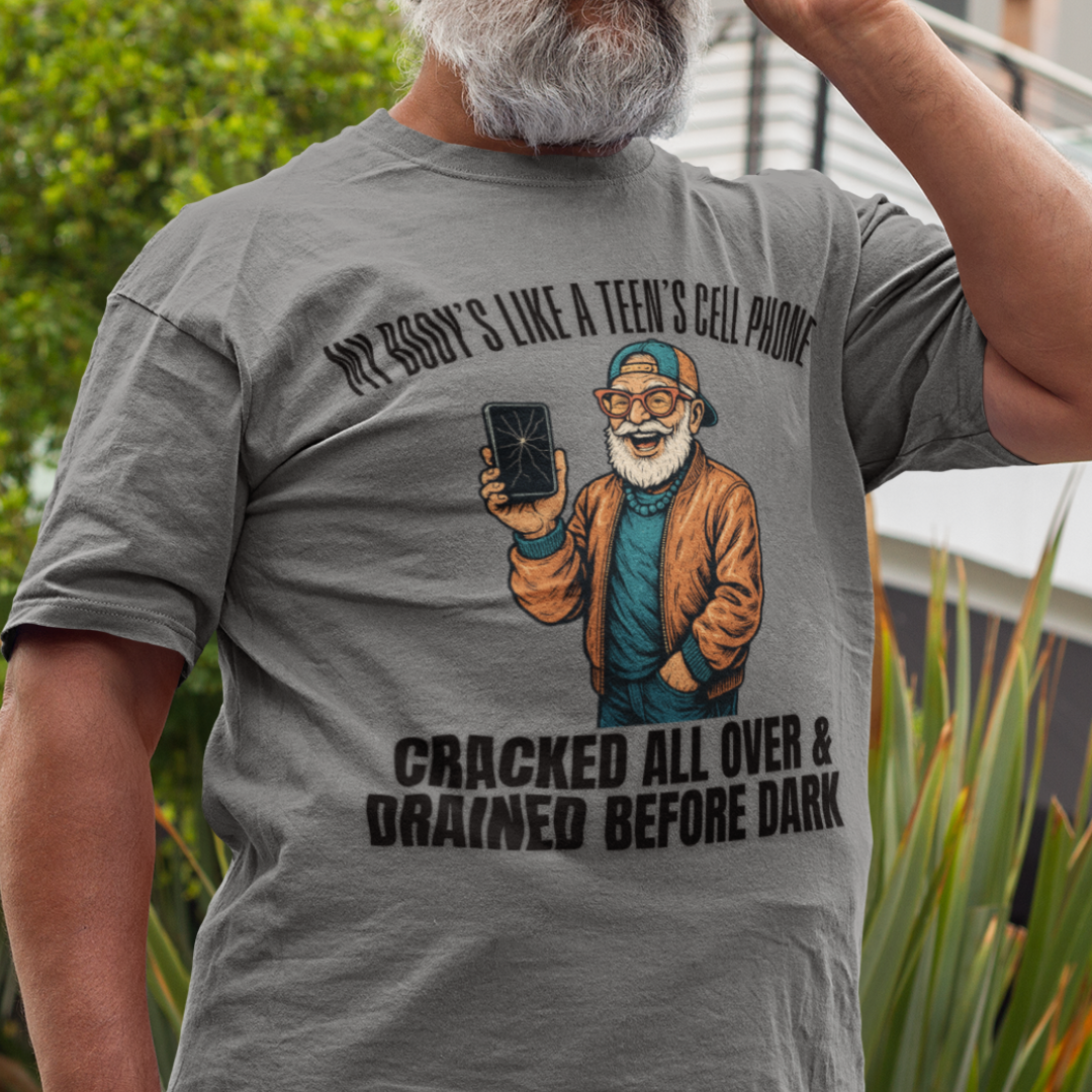 Heather gray t-shirt featuring a cartoon white-bearded man with a broken cell phone, laughing