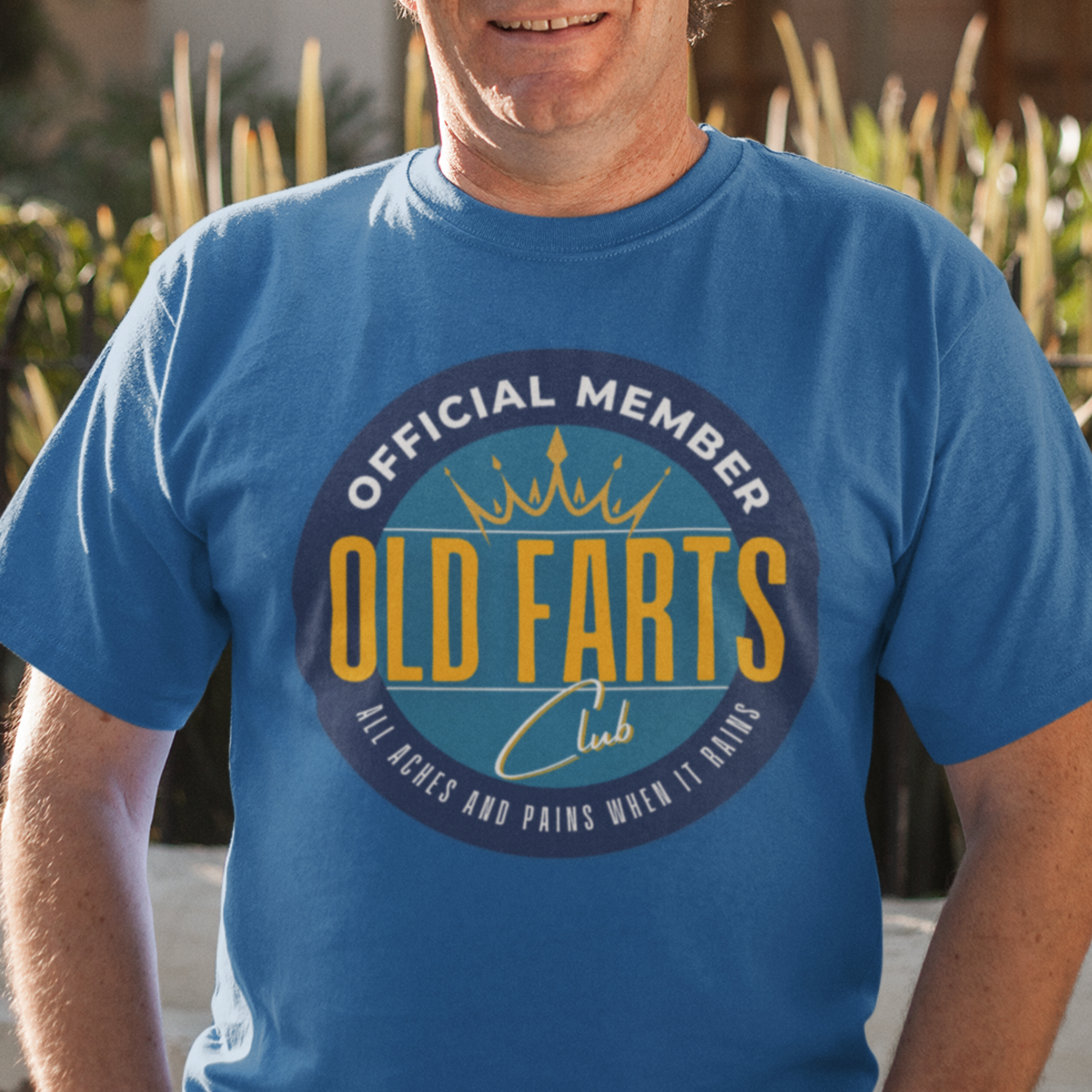 Royal blue tee featuring a yellow and blue emblem that reads Official Member Old Farts Club All Aches and Pains When it Rains