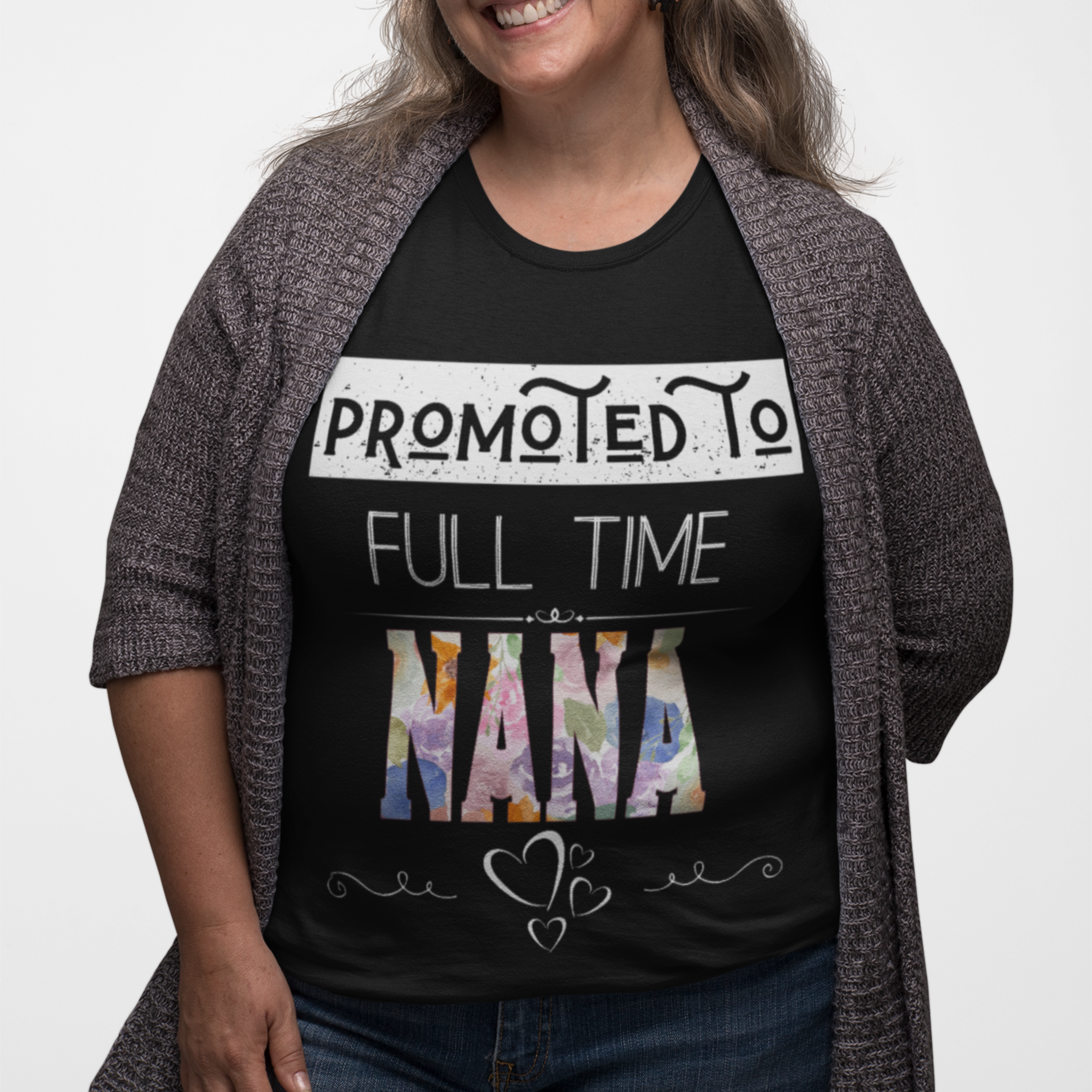 Black tee featuring bold and floral lettering that reads "Promoted to Full Time Nana"