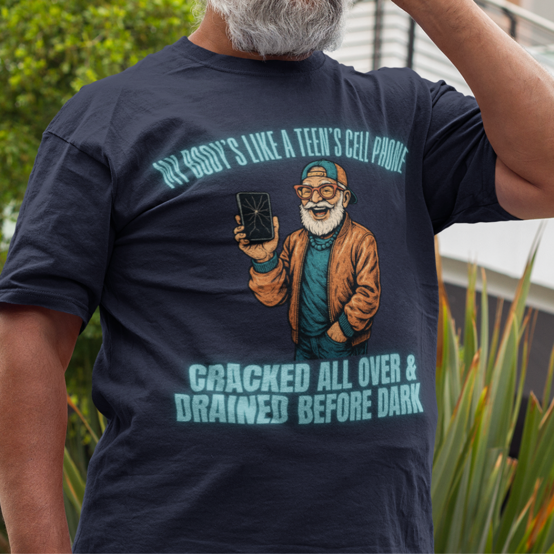 Navy blue t-shirt featuring a cartoon white-bearded man with a broken cell phone, laughing