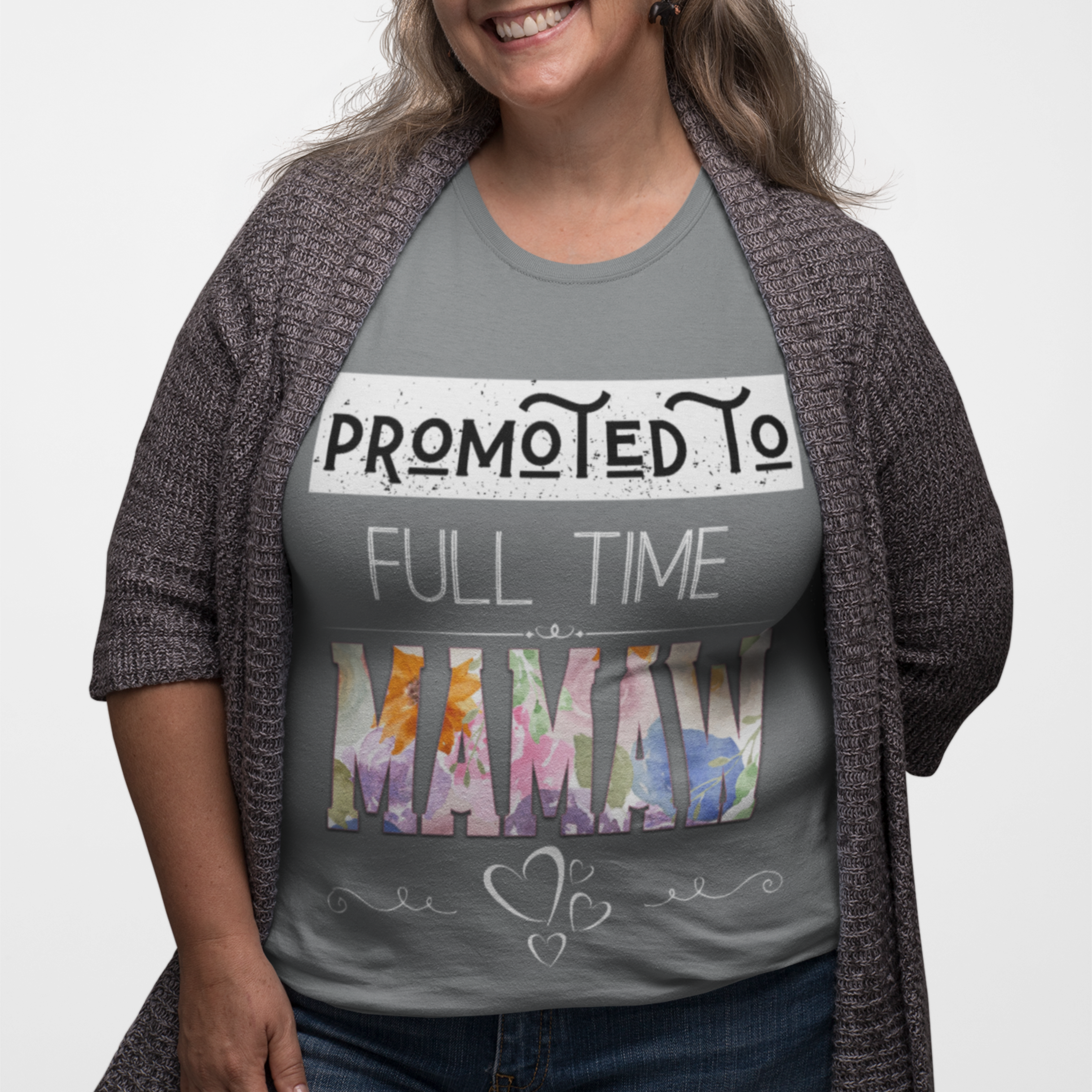 Gray tee featuring bold and floral lettering that reads "Promoted to Full Time Mamaw"