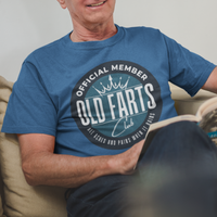 Royal blue tee featuring a blue-green insignia that reads Official Member Old Farts Club All Aches and Pains When it Rains