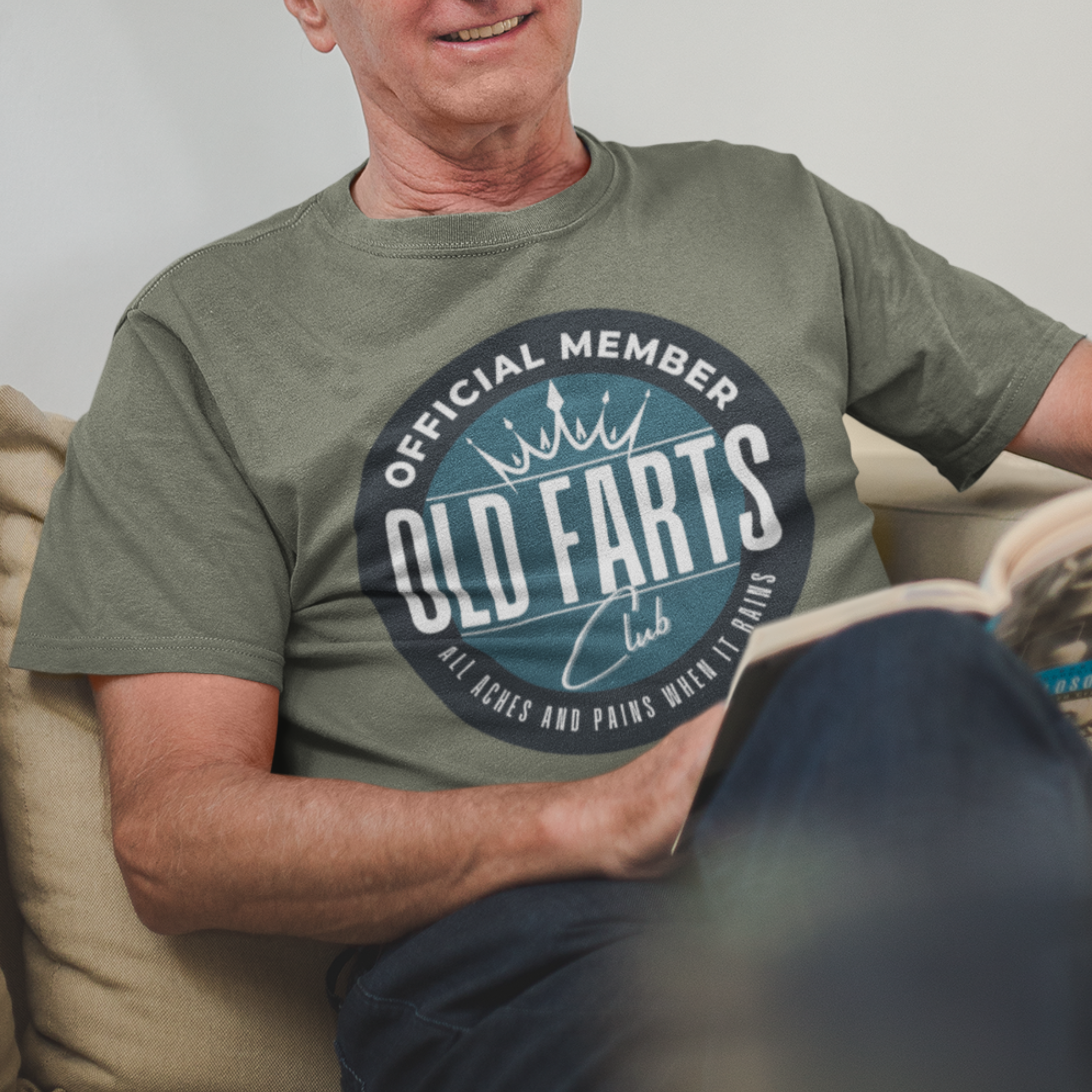 Military green tee featuring a blue-green insignia that reads Official Member Old Farts Club All Aches and Pains When it Rains