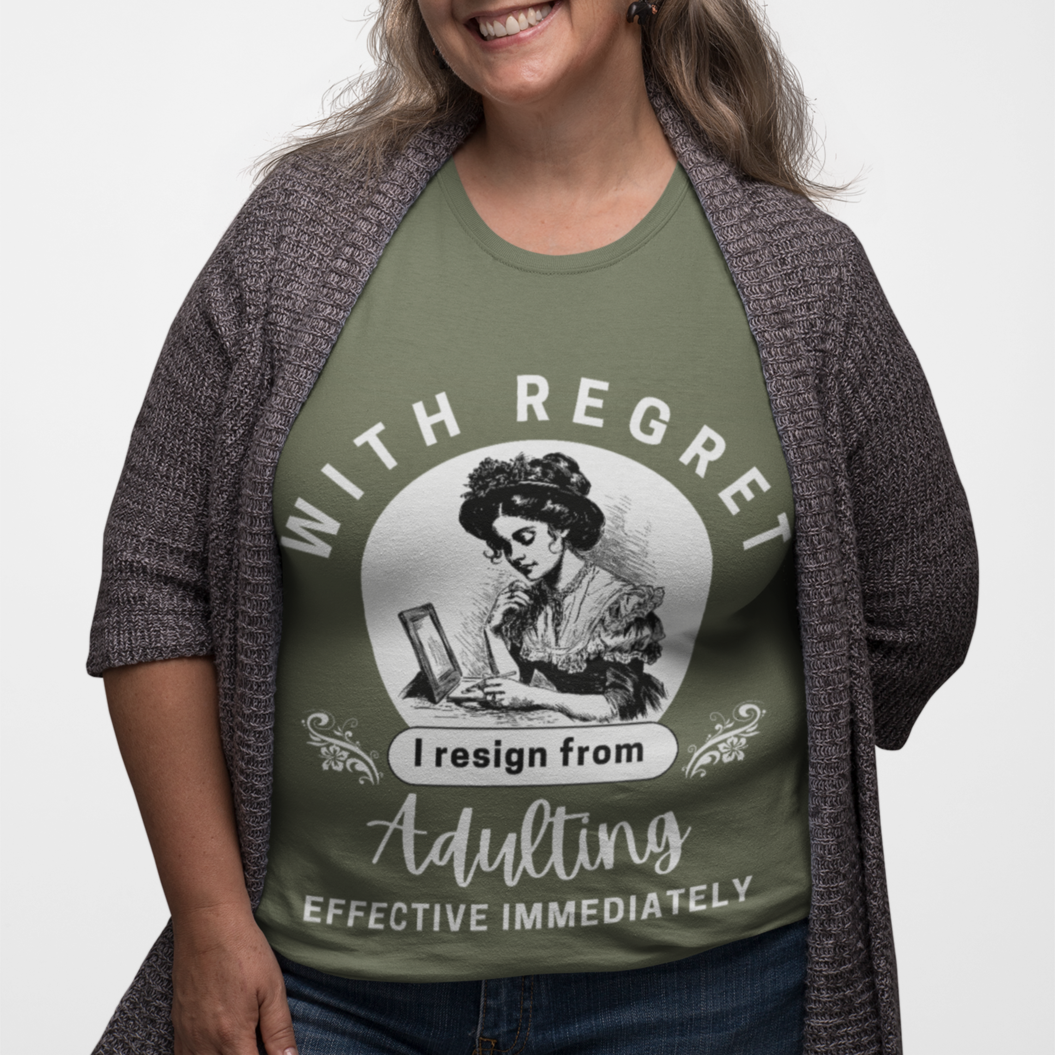 Military green tee featuring an old-fashioned lady handwriting her resignation letter to Adulting