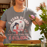 Gray t-shirt featuring an overwhelmed worker with her head down in her laptop that reads, 5 Year Plan? I'm Just Trying to Make it to 5 O'clock.