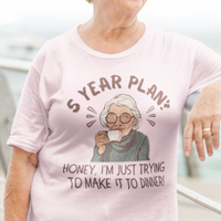 Light pink t-shirt featuring a snarky old woman drinking her favorite hot beverage