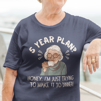 Navy blue t-shirt featuring a snarky old woman drinking her favorite hot beverage