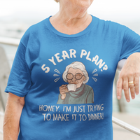 Royal blue t-shirt featuring a snarky old woman drinking her favorite hot beverage