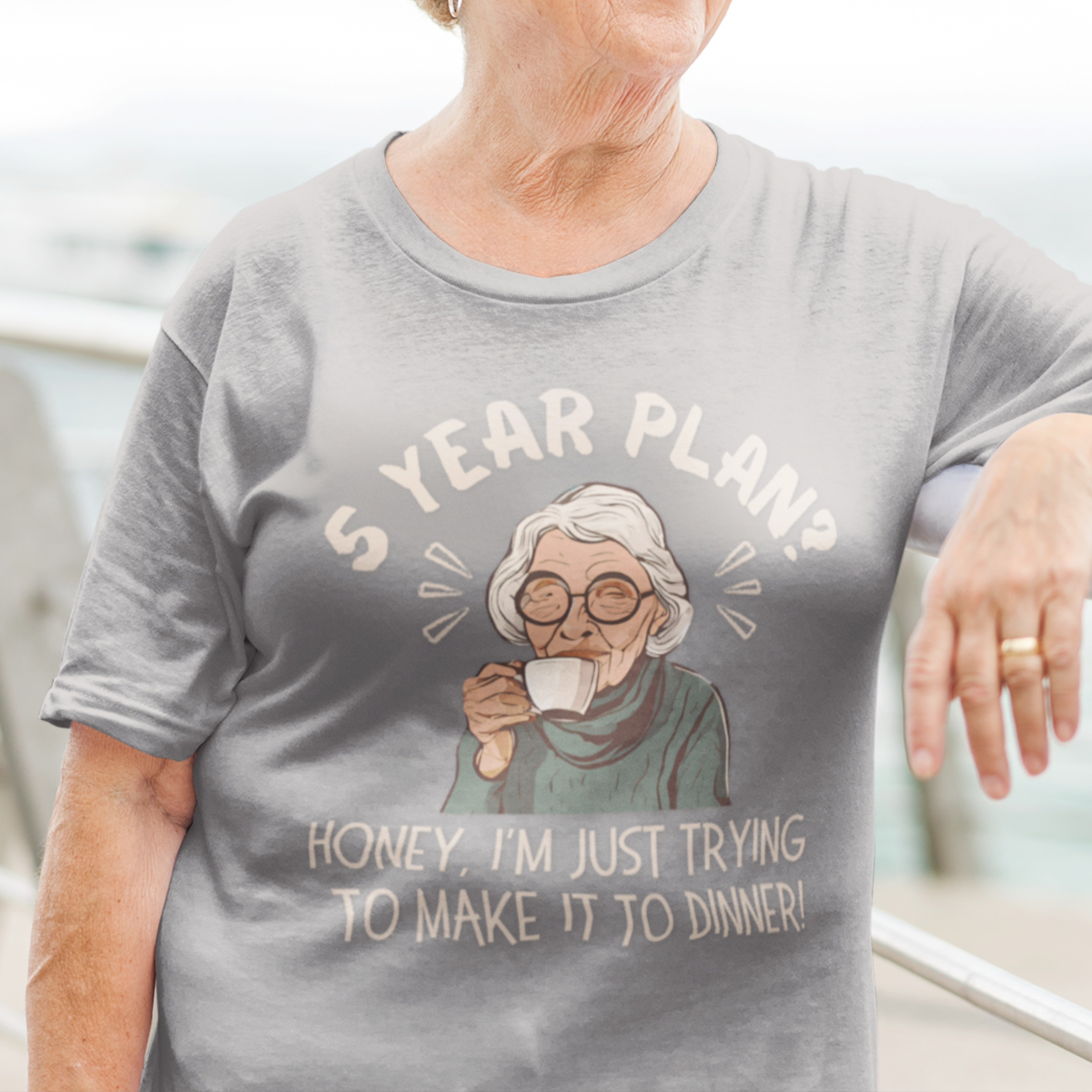 Heather gray t-shirt featuring a snarky old woman drinking her favorite hot beverage