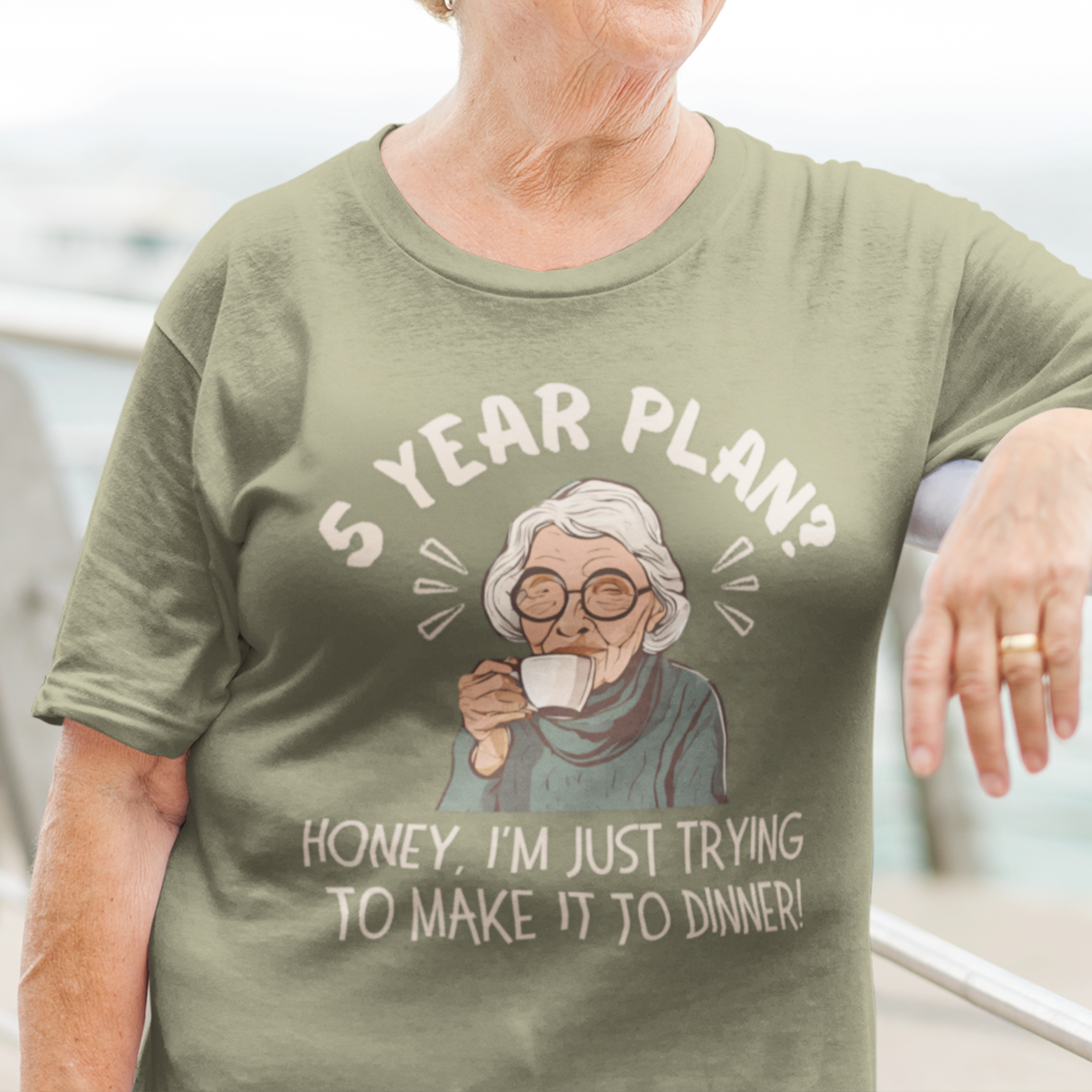 Military green t-shirt featuring a snarky old woman drinking her favorite hot beverage