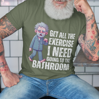 Military green t-shirt featuring a gray-haired man in pajamas with distressed bold lettering, "Get All The Exercise I Need Going to the Bathroom"