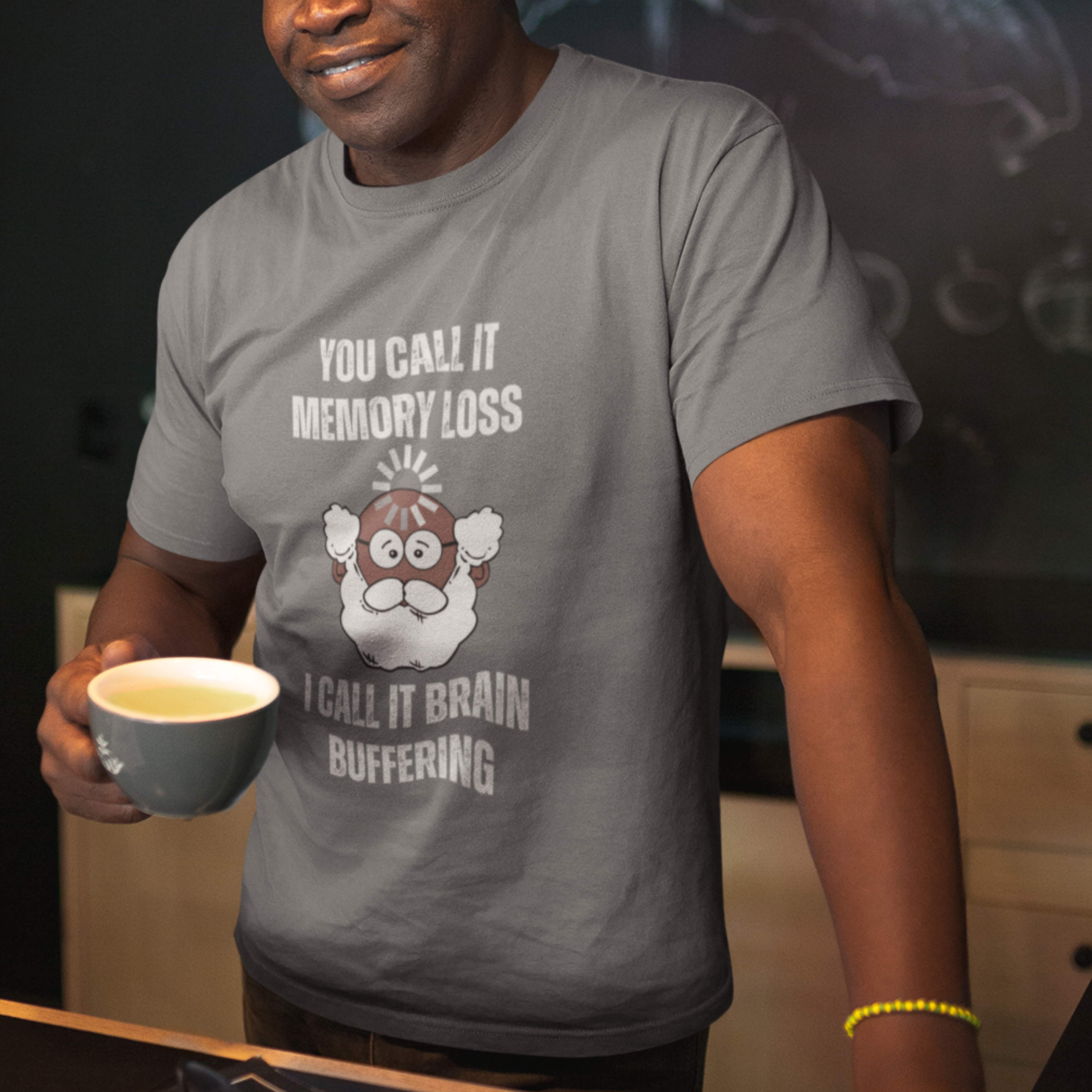 Heather gray t-shirt featuring the phrase 'Brain Buffering' with a loading icon graphic and a bald, bearded dark-toned senior.
