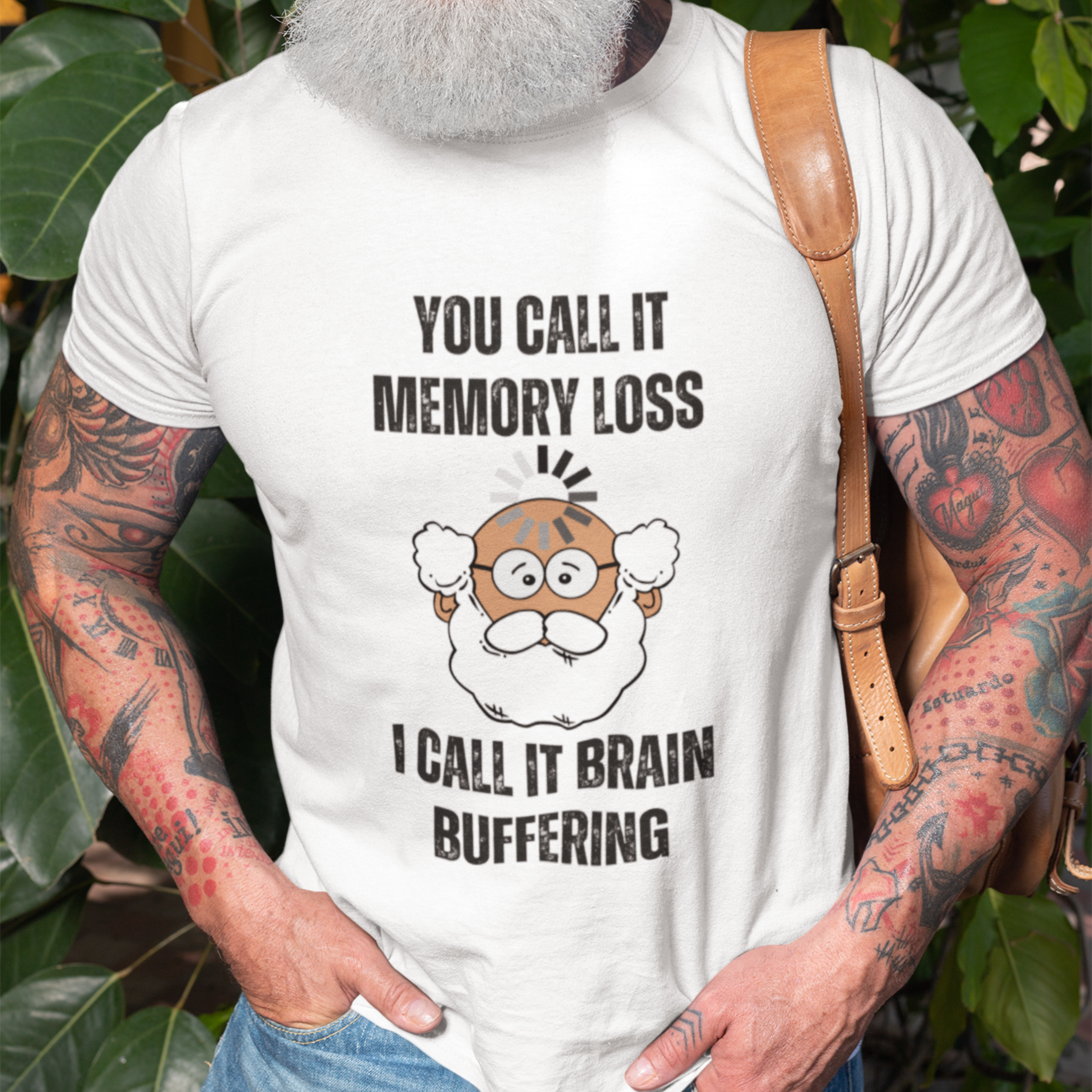 White gray t-shirt featuring the phrase 'Brain Buffering' with a loading icon graphic and a bald, bearded light-tone senior.