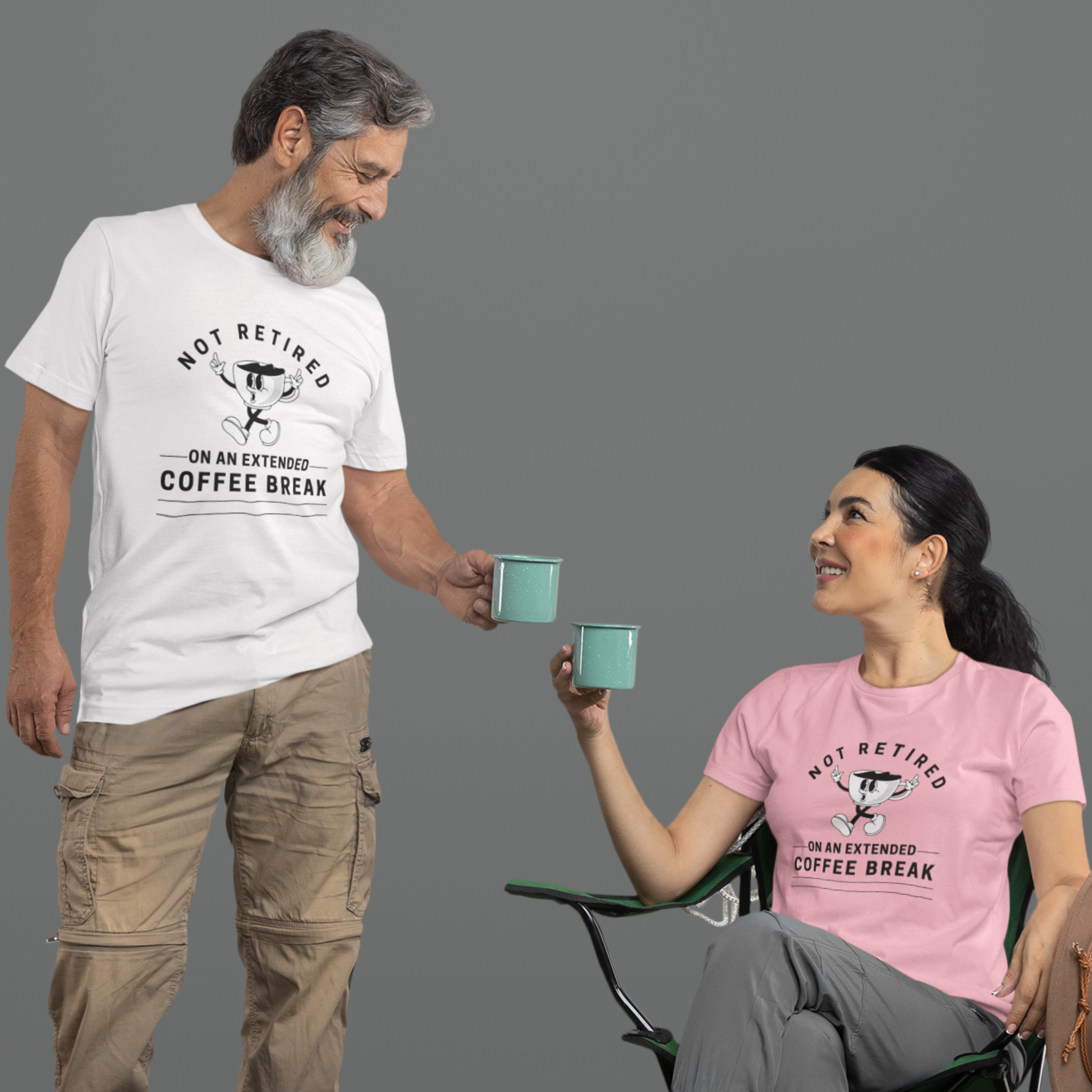 A couple in white and pink t-shirts featuring a whistling cartoon coffee cup that reads, Not Retired On An Extended Coffee Break. 