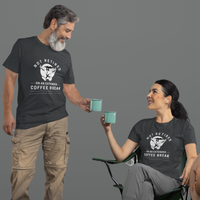A couple in back t-shirts featuring a whistling cartoon coffee cup that reads, Not Retired On An Extended Coffee Break. 