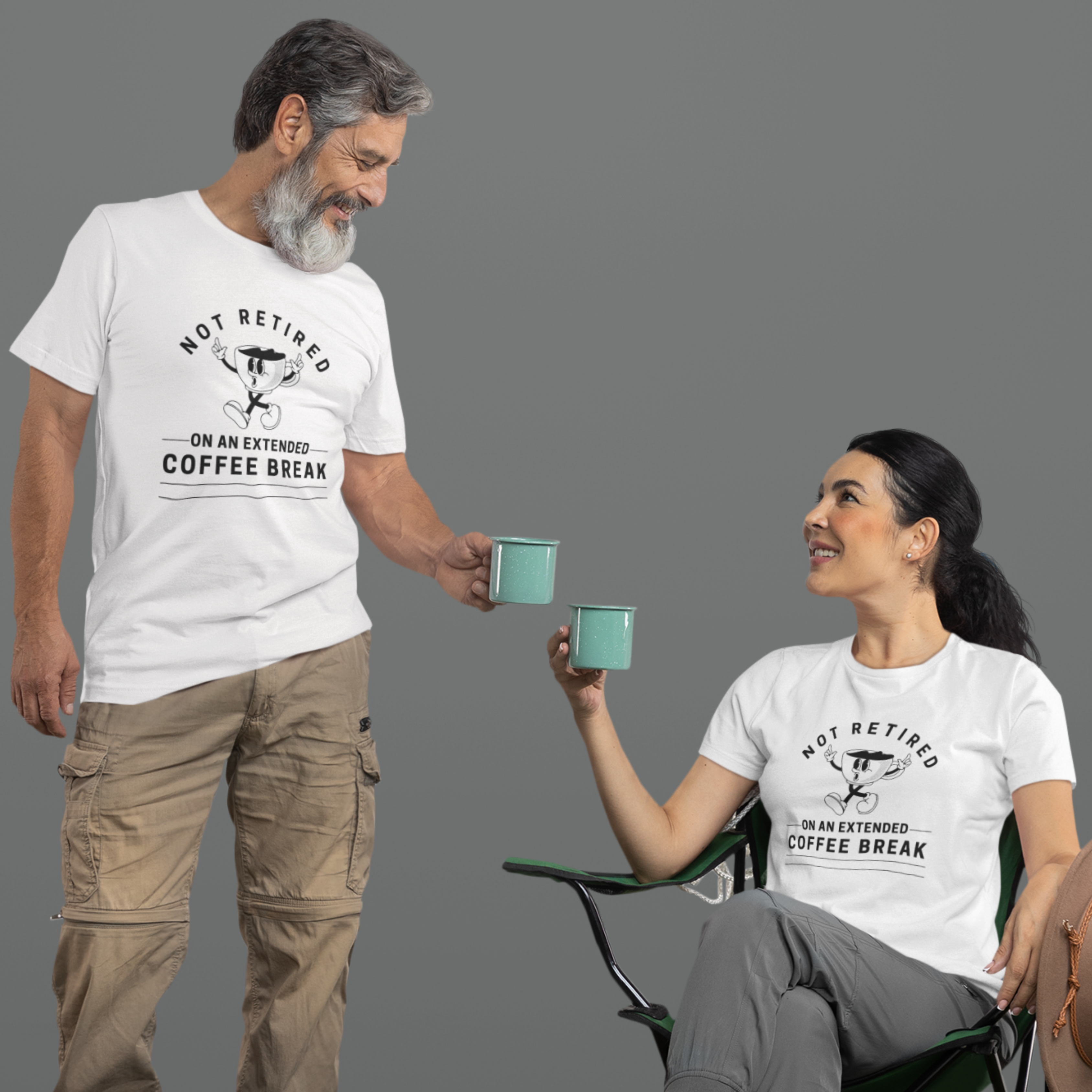 A couple in white t-shirts featuring a whistling cartoon coffee cup that reads, Not Retired On An Extended Coffee Break. 