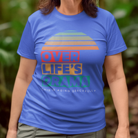 Royal blue t-shirt that reads Over Life's Drama This is Aging Gracefully, featuring colorful block lettering and a rainbow striped sunset.
