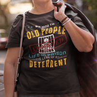 Black t-shirt that reads Be Kind to Old People Life in Prison is Less of a Deterrent and features a prisoner behind bars pictogram.