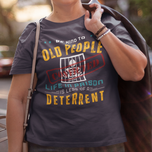 Navy blue t-shirt that reads Be Kind to Old People Life in Prison is Less of a Deterrent and features a prisoner behind bars pictogram.